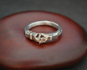 Holding hands ring hot sale with hidden heart