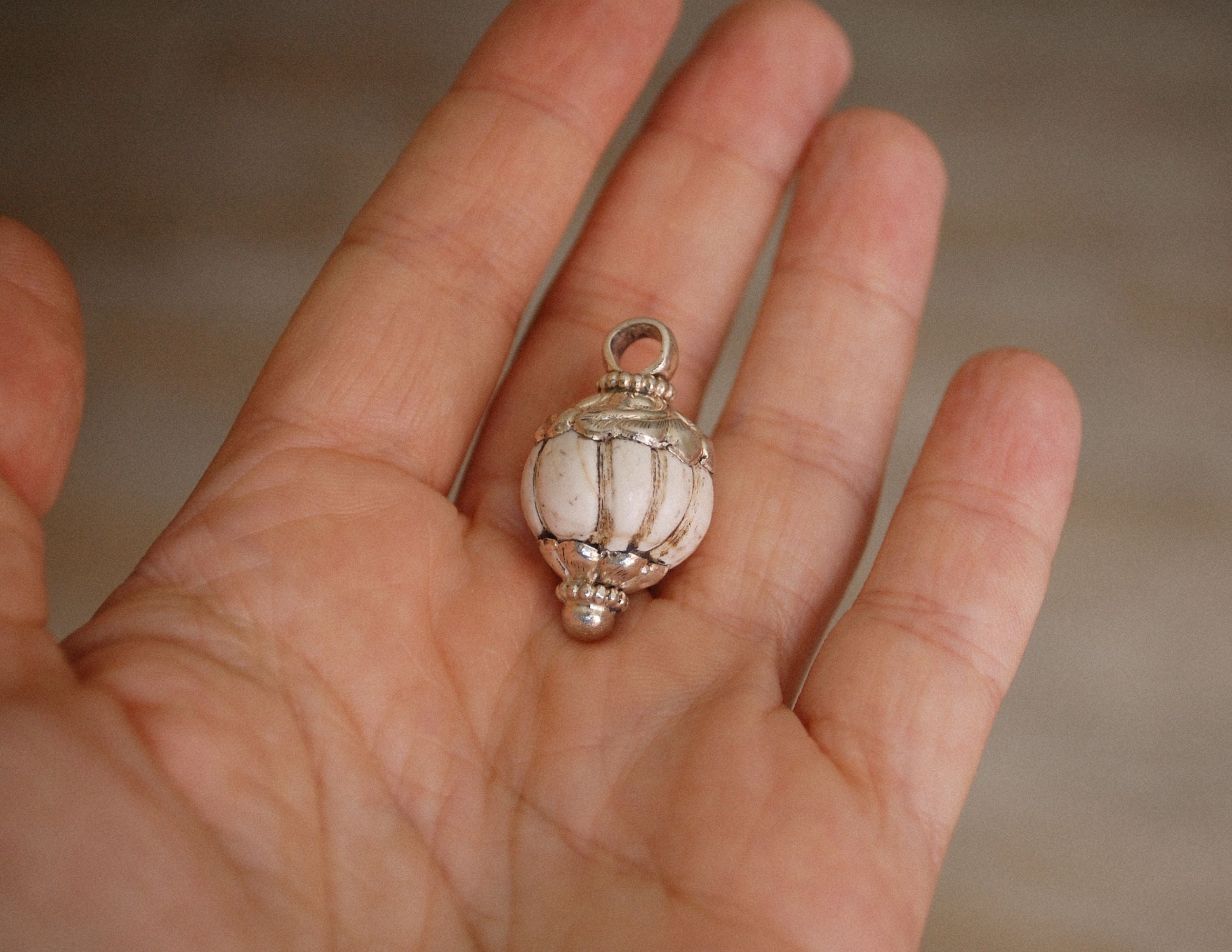 Nepalese Shell Pendant with Repoussee Setting