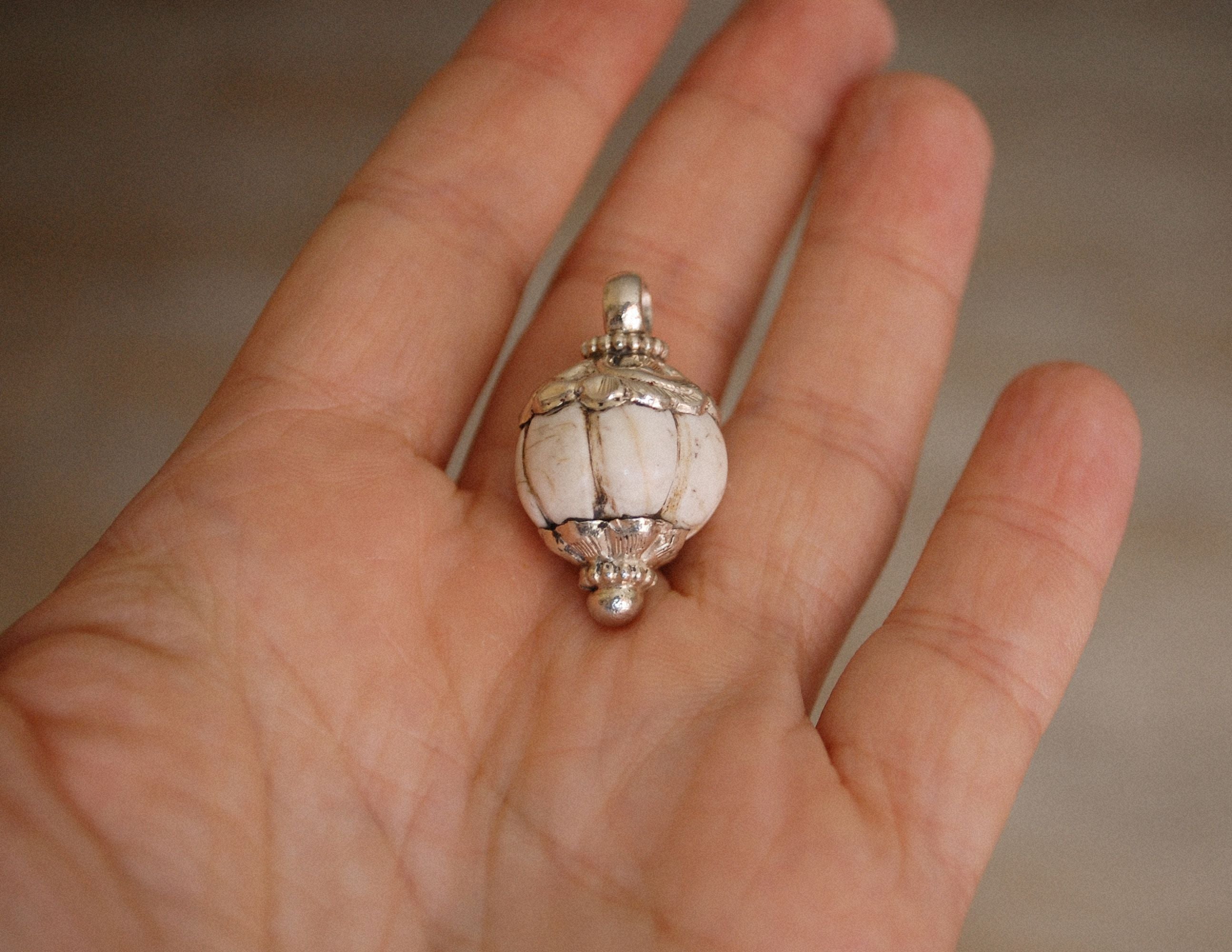 Nepalese Shell Pendant with Repoussee Setting